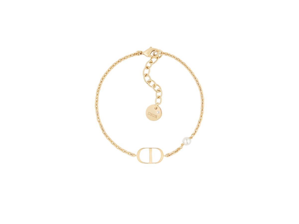 https://d2cva83hdk3bwc.cloudfront.net/dior-petit-cd-bracelet-in-gold-finish-metal-with-a-white-resin-pearl-1.jpg