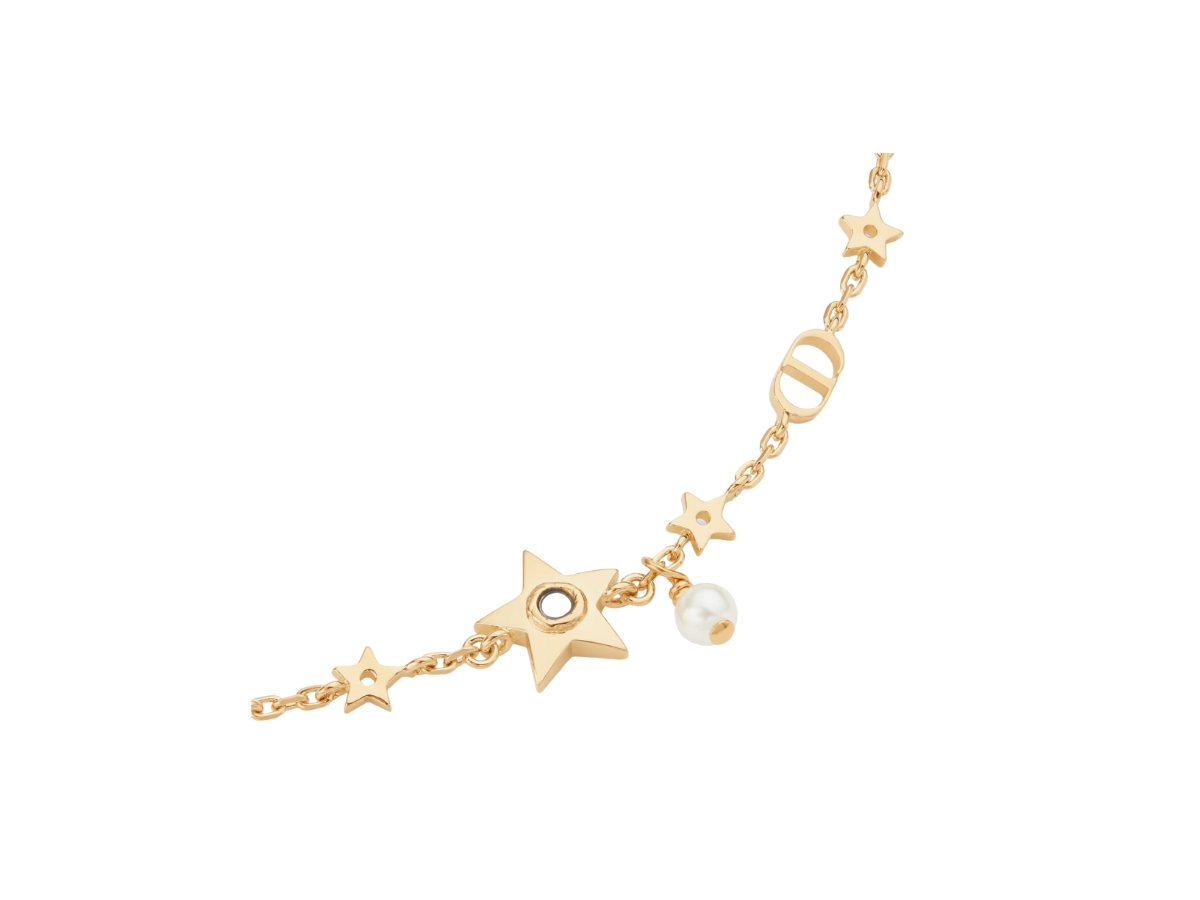 https://d2cva83hdk3bwc.cloudfront.net/dior-star-bracelet-in-star-detail-gold-finish-metal-with-a-white-resin-pearl-and-mirror-2.jpg