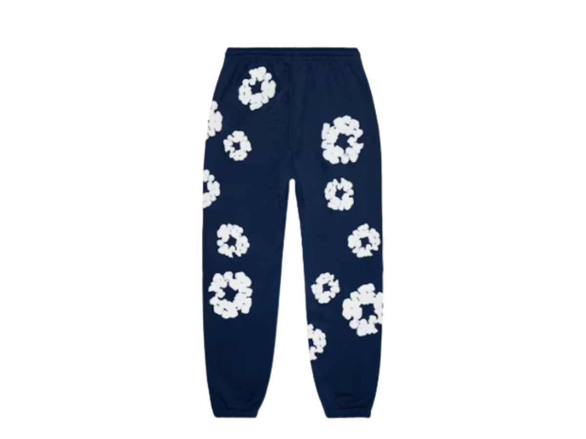 https://d2cva83hdk3bwc.cloudfront.net/dnt-ptadttcwsn-denim-tears-the-cotton-wreath-sweatpants-navy-2.jpg