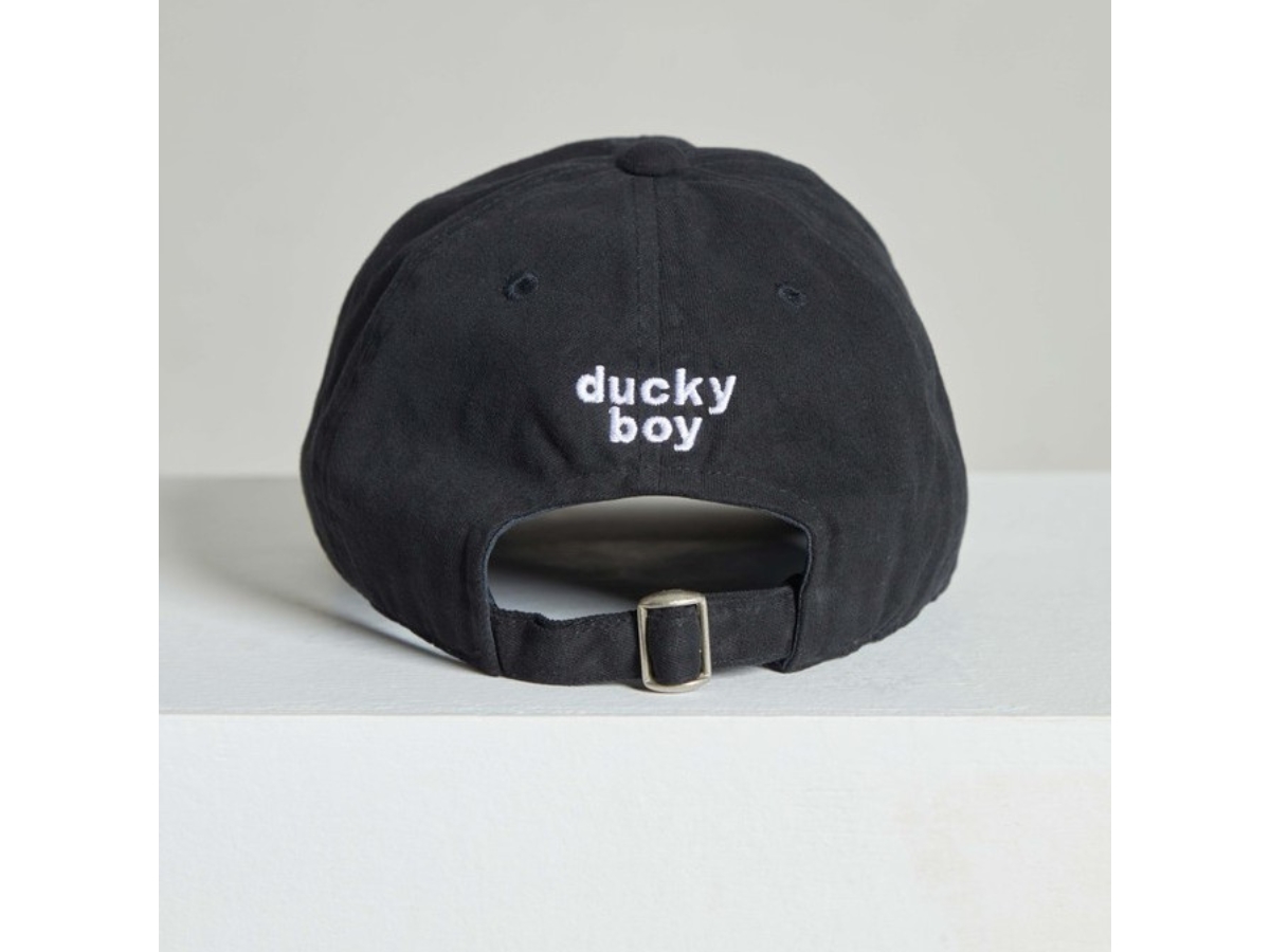https://d2cva83hdk3bwc.cloudfront.net/duckyboy-ripped-cap-physical-distancing-2021-black-2.jpg