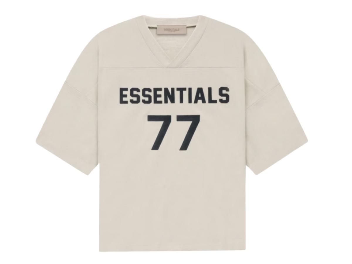 https://d2cva83hdk3bwc.cloudfront.net/fear-of-god-essentials-women-s-football-77-t-shirt-wheat-1.jpg