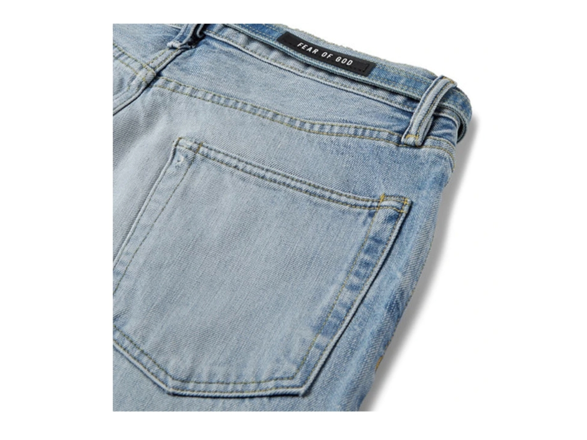https://d2cva83hdk3bwc.cloudfront.net/fear-of-god-slim-fit-distressed-denim-jeans-indigo-3.jpg