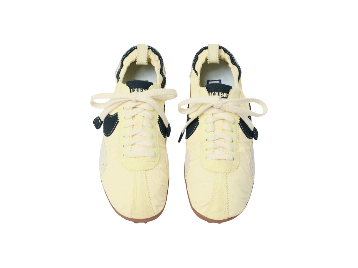 https://d2cva83hdk3bwc.cloudfront.net/fou00176aw00712206-jacquemus-x-nike-moon-shoe-jacquemus-pale-yellow-3.jpg