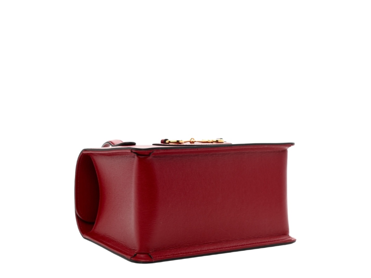 https://d2cva83hdk3bwc.cloudfront.net/gc-habbgmh1fthbitcwghr-gucci-mini-horsebit-1955-foldover-top-handle-bag-in-textured-calfskin-with-gold-hardware-red-3.jpg