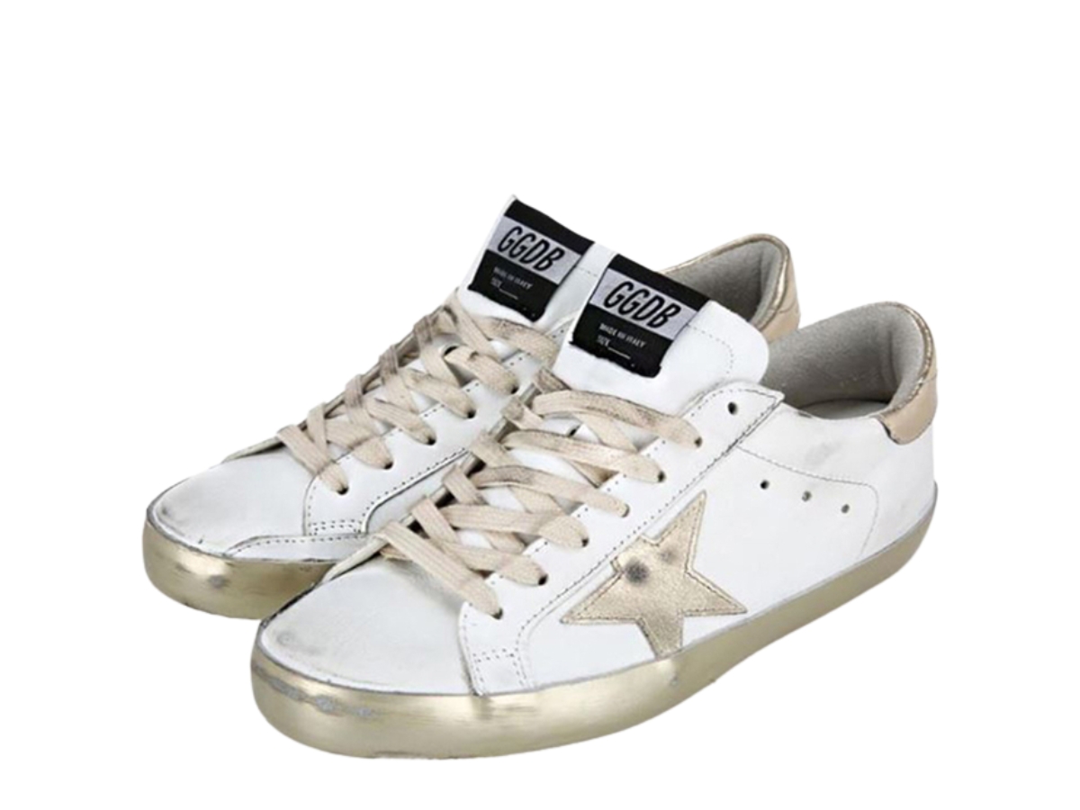 https://d2cva83hdk3bwc.cloudfront.net/golden-goose-superstar-sneakers-sparkle-white-gold-heel-tab-2.jpg