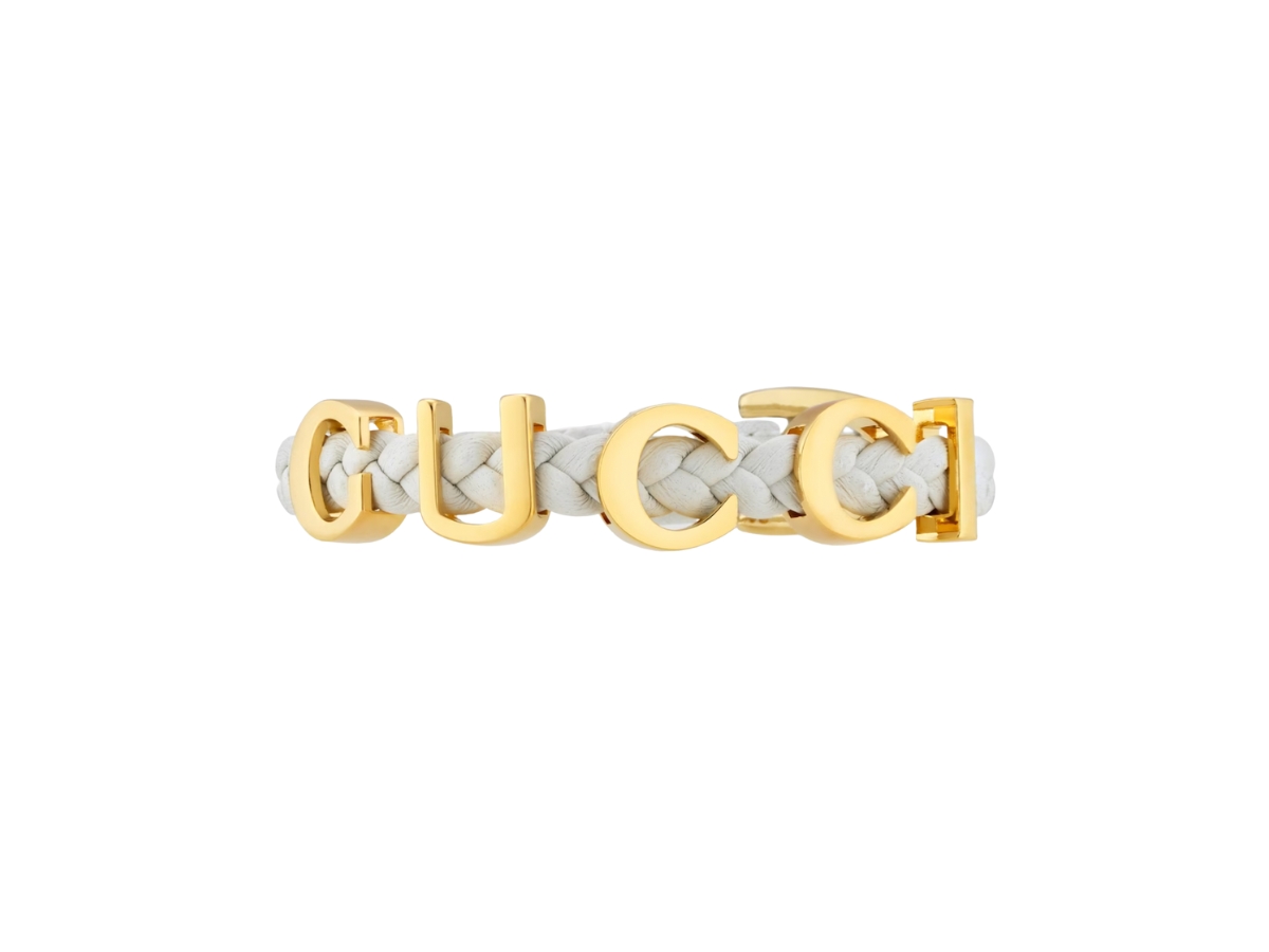https://d2cva83hdk3bwc.cloudfront.net/gucci--gucci--bracelet-in-white-leather-with-gold-metal-hardware-2.jpg
