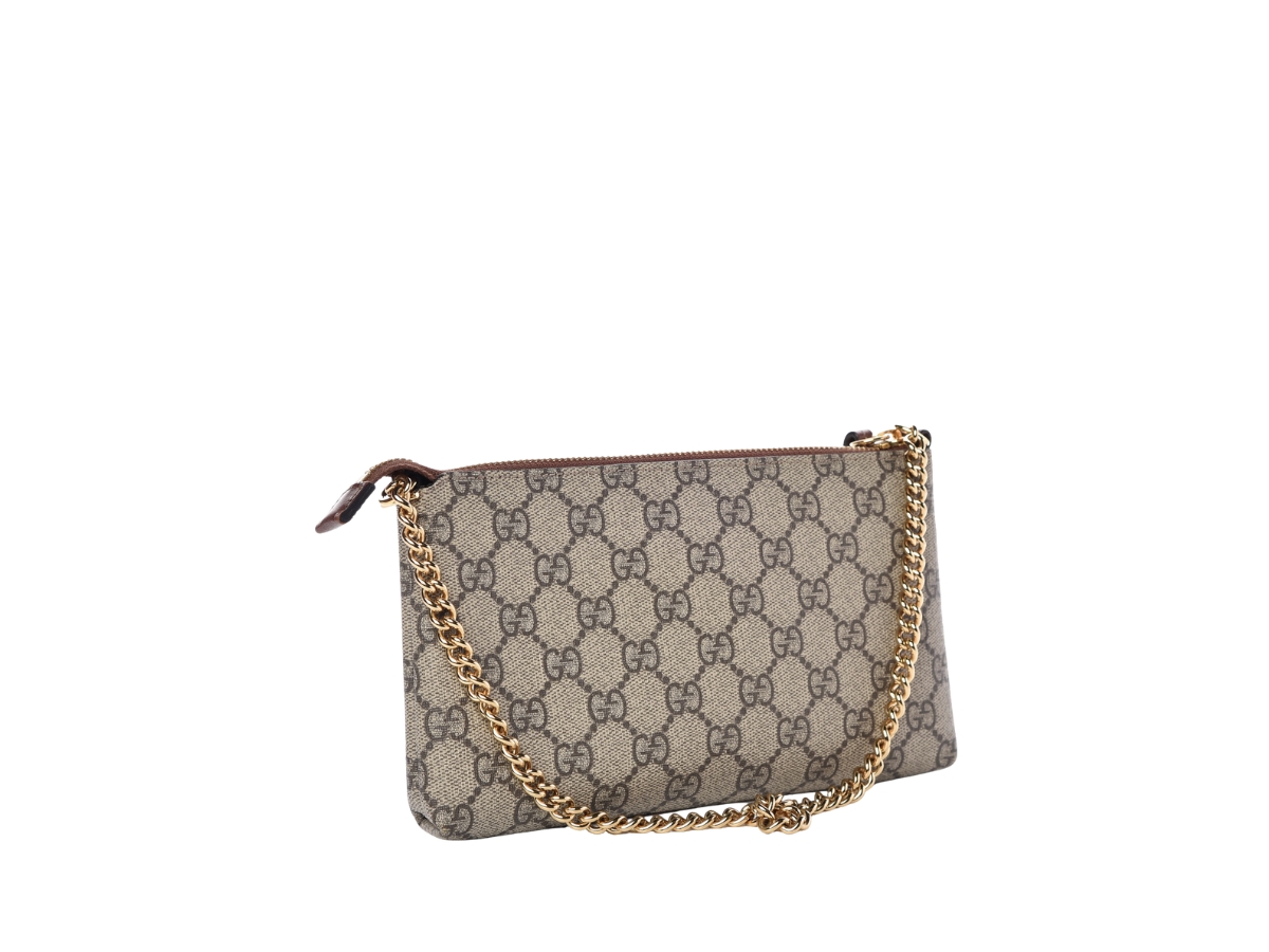 https://d2cva83hdk3bwc.cloudfront.net/gucci-chain-wrist-wallet-in-beige-gg-supreme-canvas-with-leather-trim-and-polished-gold-chain-strap-2.jpg