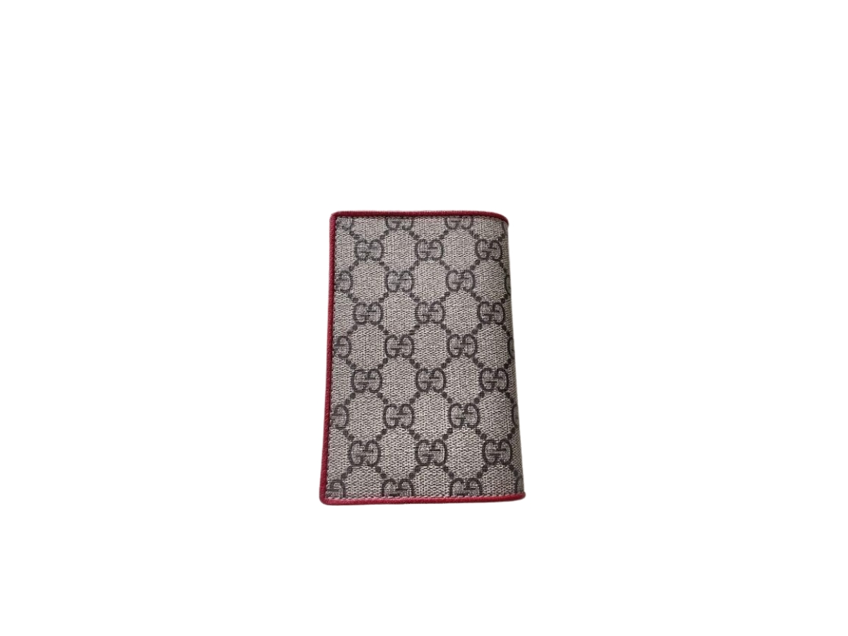 https://d2cva83hdk3bwc.cloudfront.net/gucci-gg-passport-case-in-beige-ebony-gg-supreme-canvas-red-patch-2.jpg