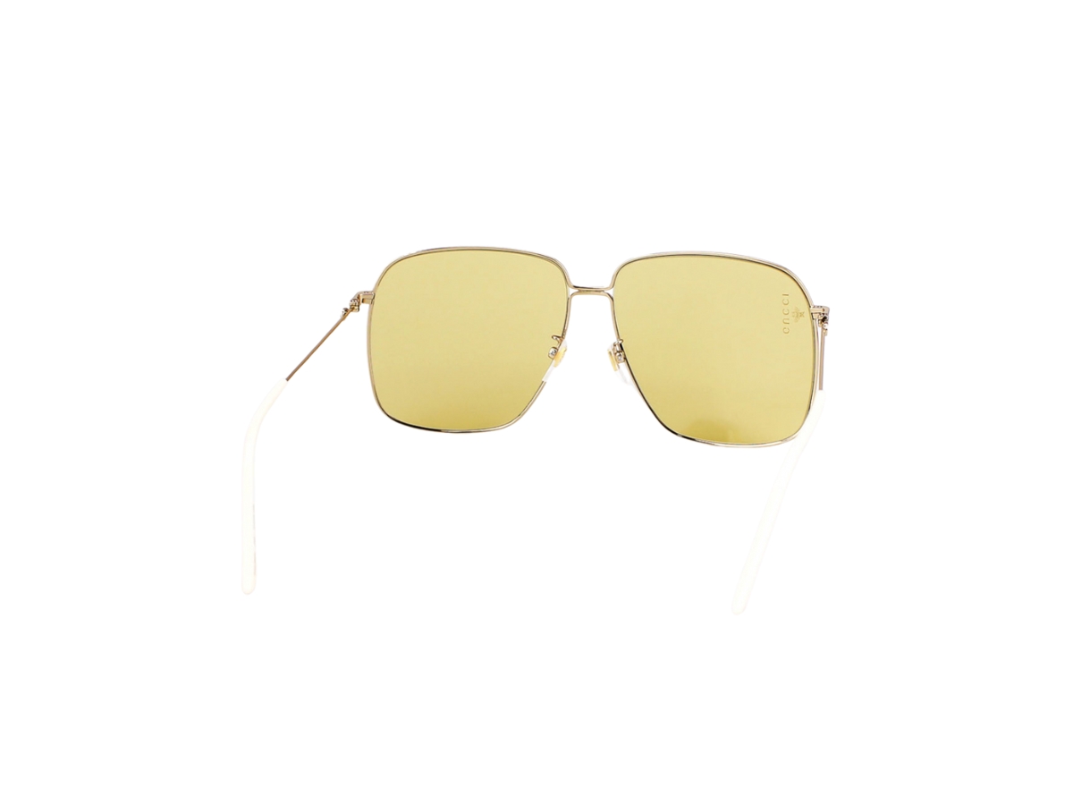https://d2cva83hdk3bwc.cloudfront.net/gucci-gg0394s-sunglasses-in-gold-metal-and-plastic-with-yellow-lens-4.jpg
