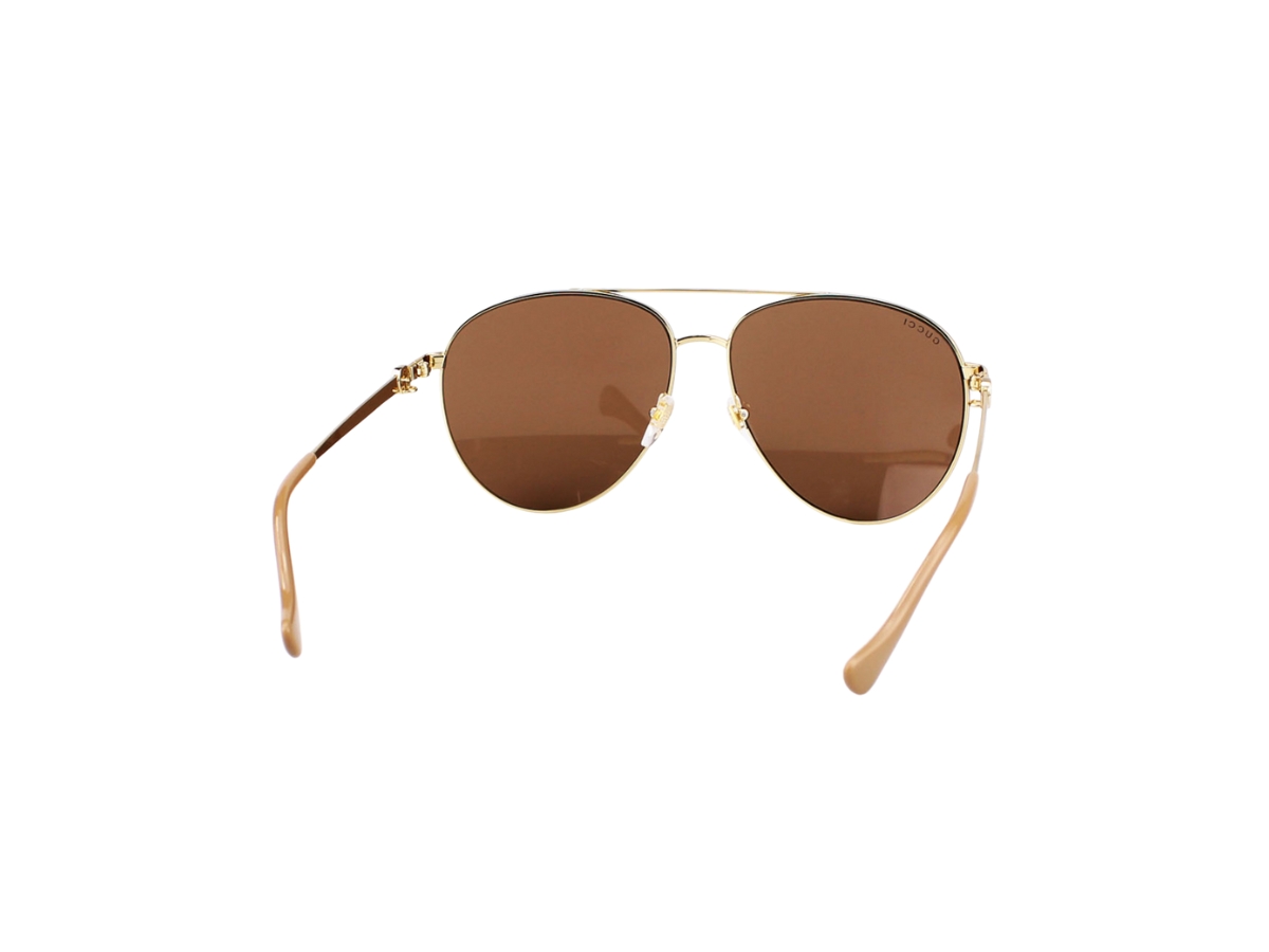 https://d2cva83hdk3bwc.cloudfront.net/gucci-gg1088s-sunglasses-in-gold-metal-with-brown-lens-4.jpg