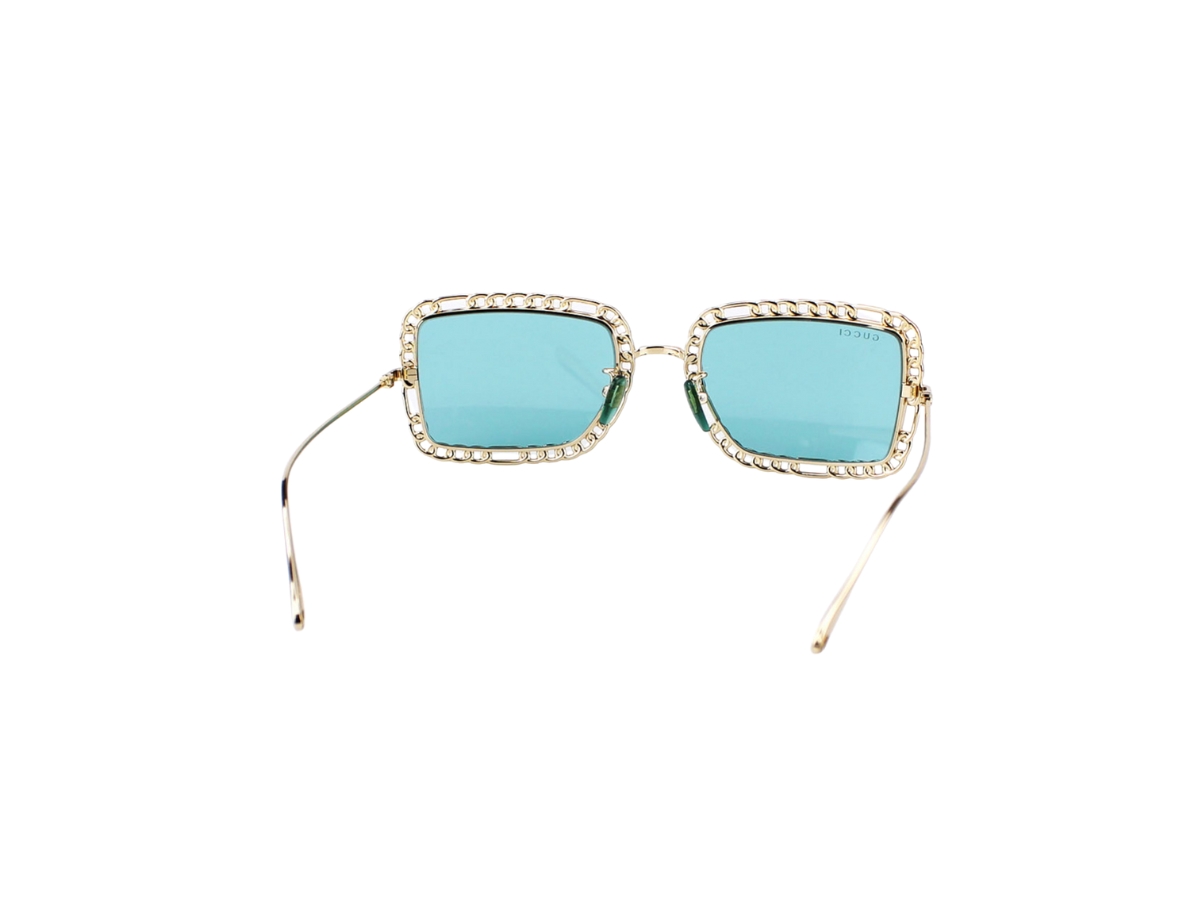 https://d2cva83hdk3bwc.cloudfront.net/gucci-gg1112s-sunglasses-in-gold-metal-with-green-lens-4.jpg