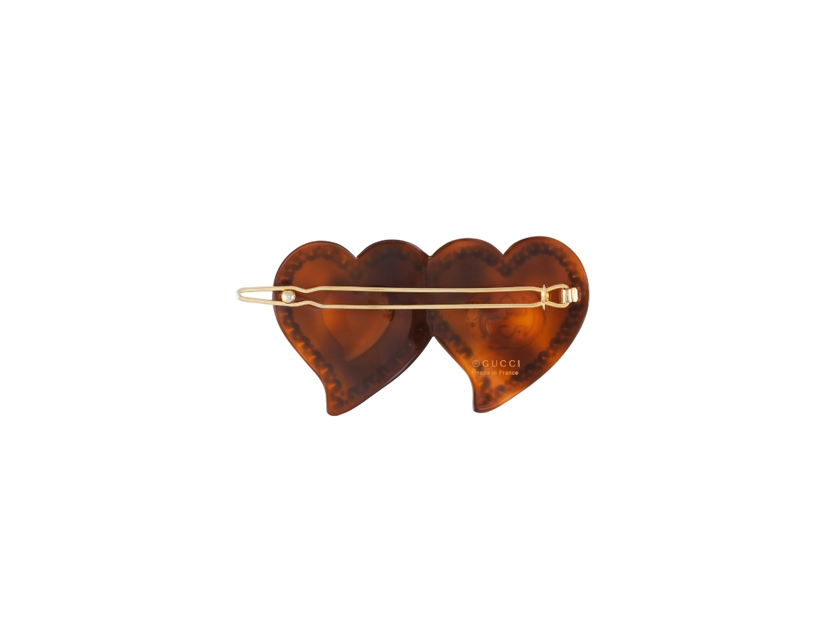 https://d2cva83hdk3bwc.cloudfront.net/gucci-hair-clip-with-gg-and-hearts-in-tortoiseshell-resin-two-heart-pink-interlocking-g-mini-heart-with-crystal-trim-2.jpg