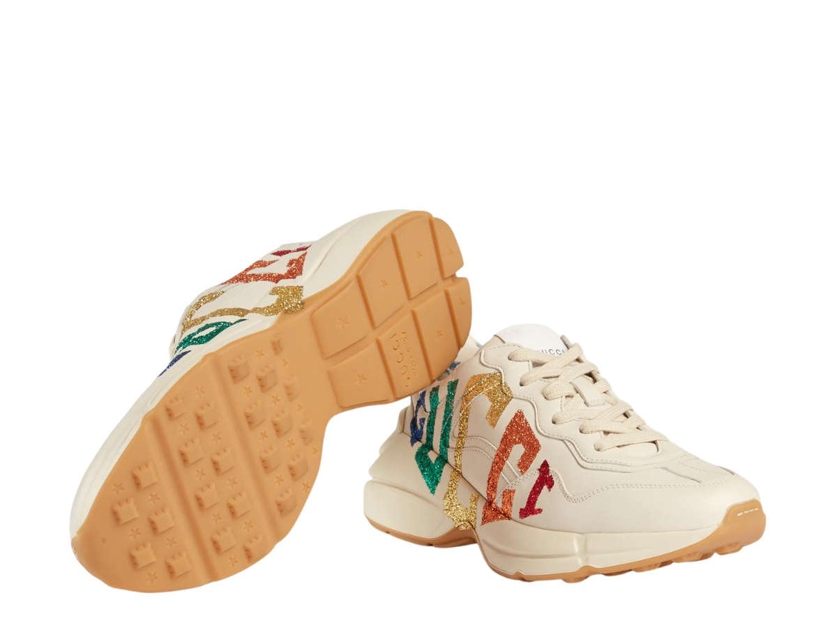 https://d2cva83hdk3bwc.cloudfront.net/gucci-women-s-rhyton-glitter-gucci-sneaker-in-white-leather-with-rainbow-glitter-gucci-game-motif-3.jpg