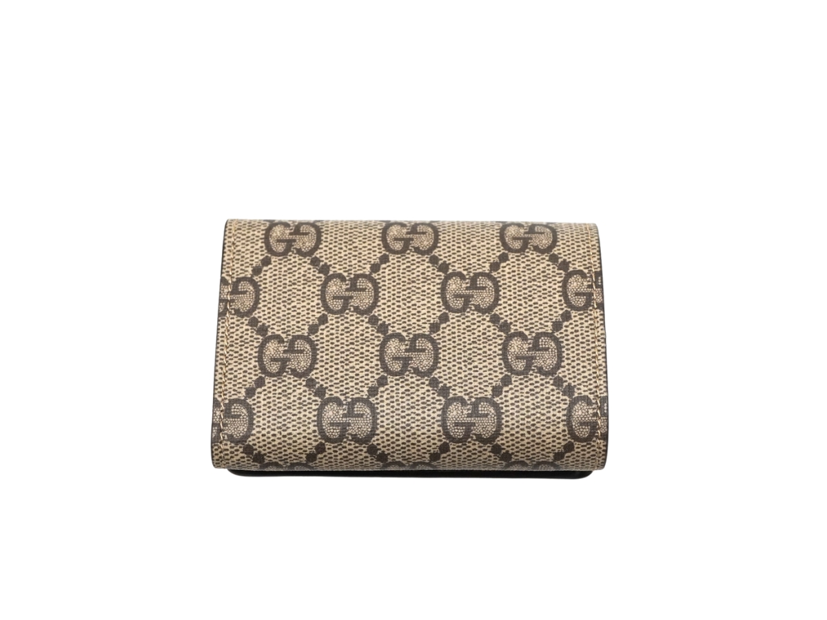 https://d2cva83hdk3bwc.cloudfront.net/gucci-x-balenciaga-the-hacker-project-compact-wallet-in-gg-supreme-canvas-beige-ebony-2.jpg