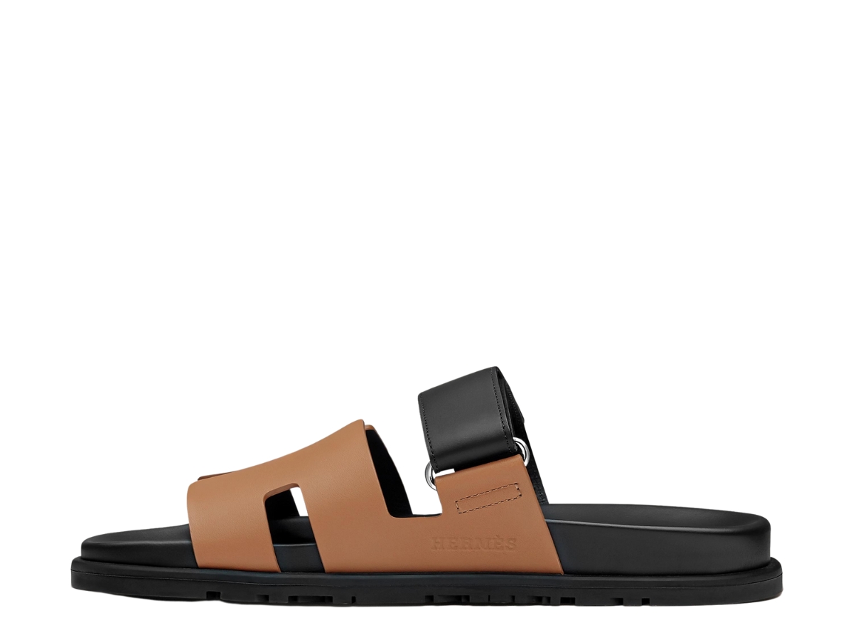 https://d2cva83hdk3bwc.cloudfront.net/hermes-chypre-sandal-in-calfskin-with-anatomical-rubber-sole-and-adjustable-strap-naturel-safari-noir-2.jpg