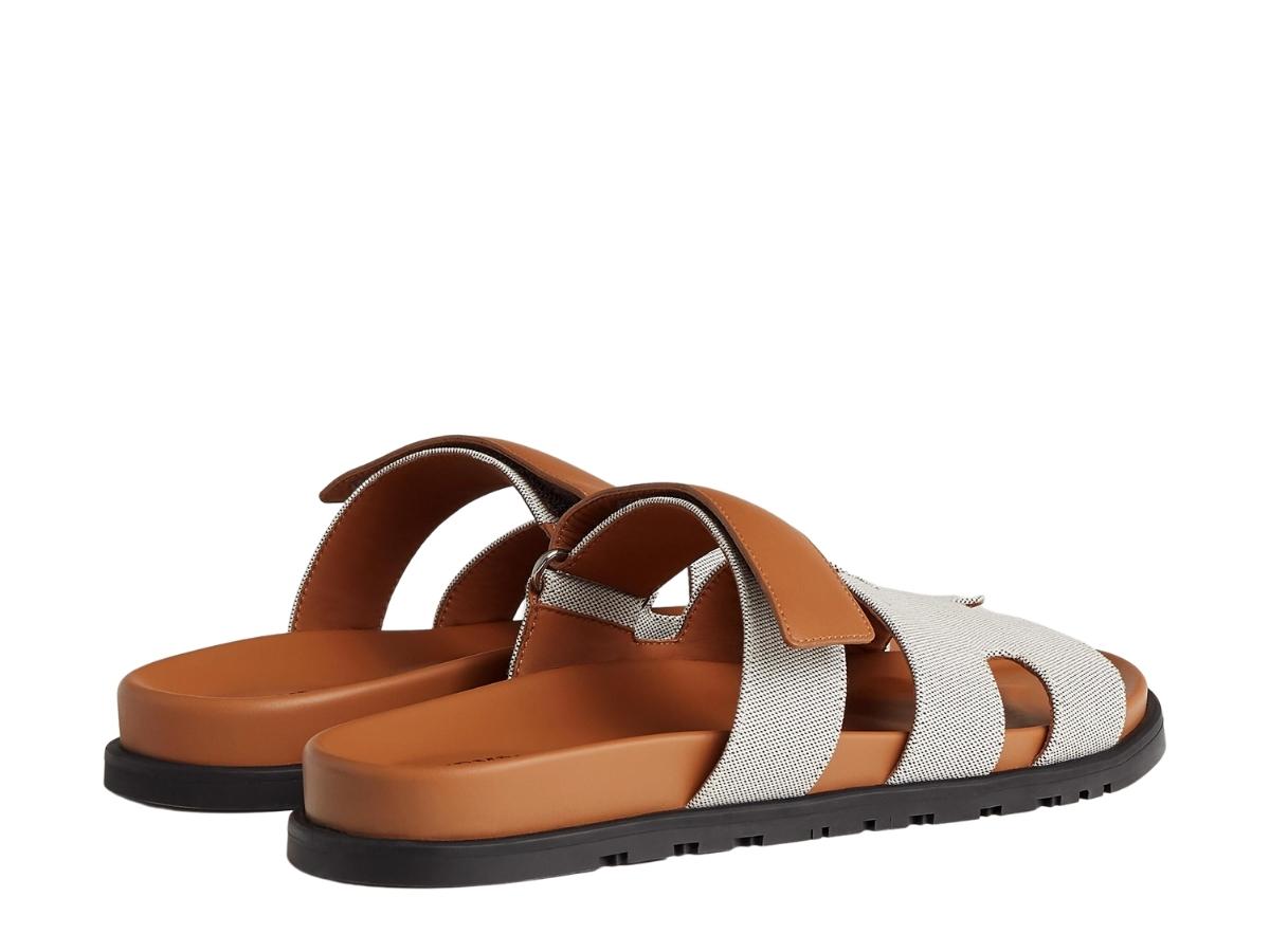 https://d2cva83hdk3bwc.cloudfront.net/hermes-chypre-sandal-in-h-canvas-and-calfskin-with-anatomical-rubber-sole-and-adjustable-strap-prunoir-naturel-3.jpg
