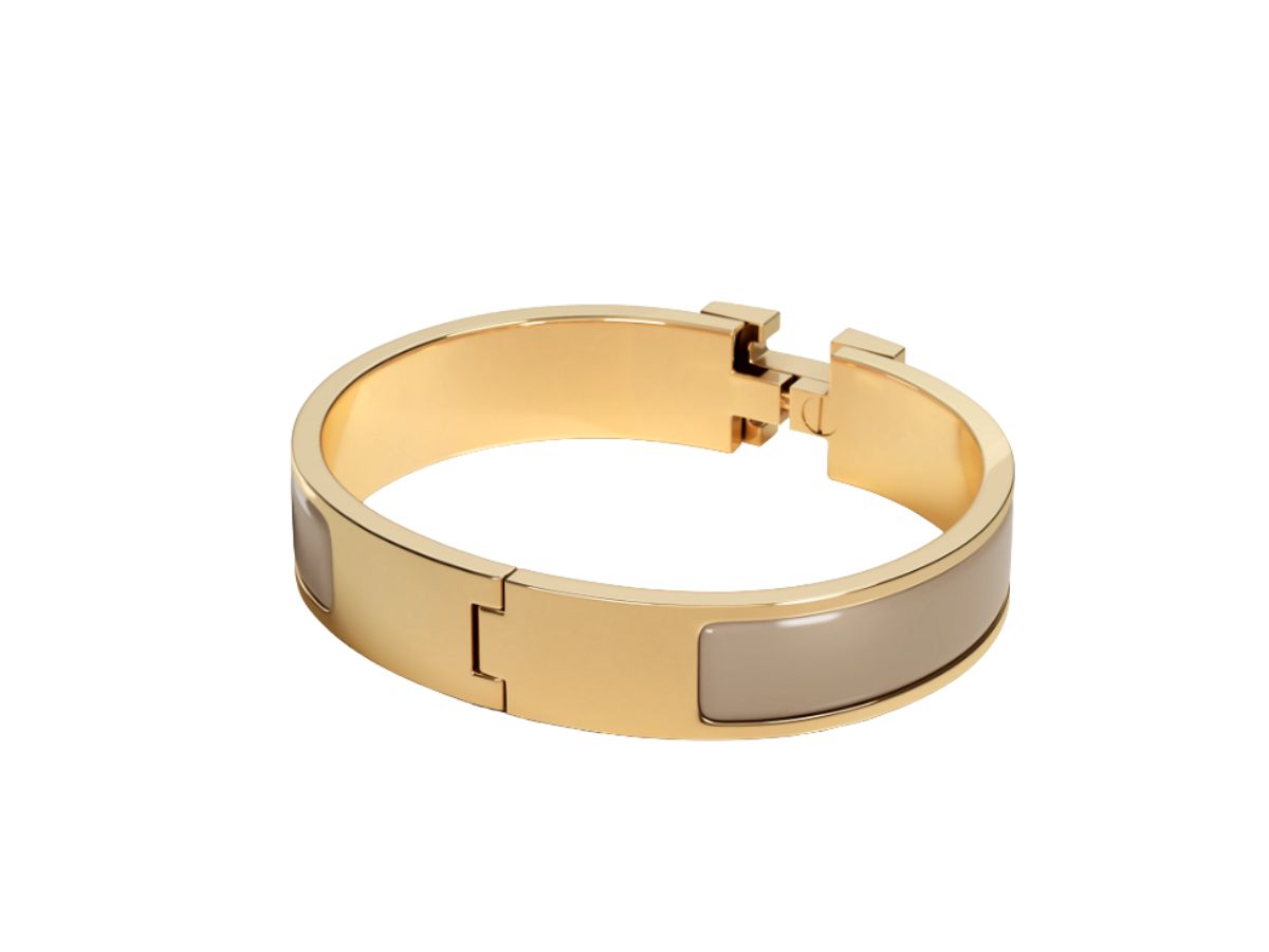 https://d2cva83hdk3bwc.cloudfront.net/hermes-clic-h-bracelet-in-enamel-with-gold-plated-hardware-marron-glace-2.jpg