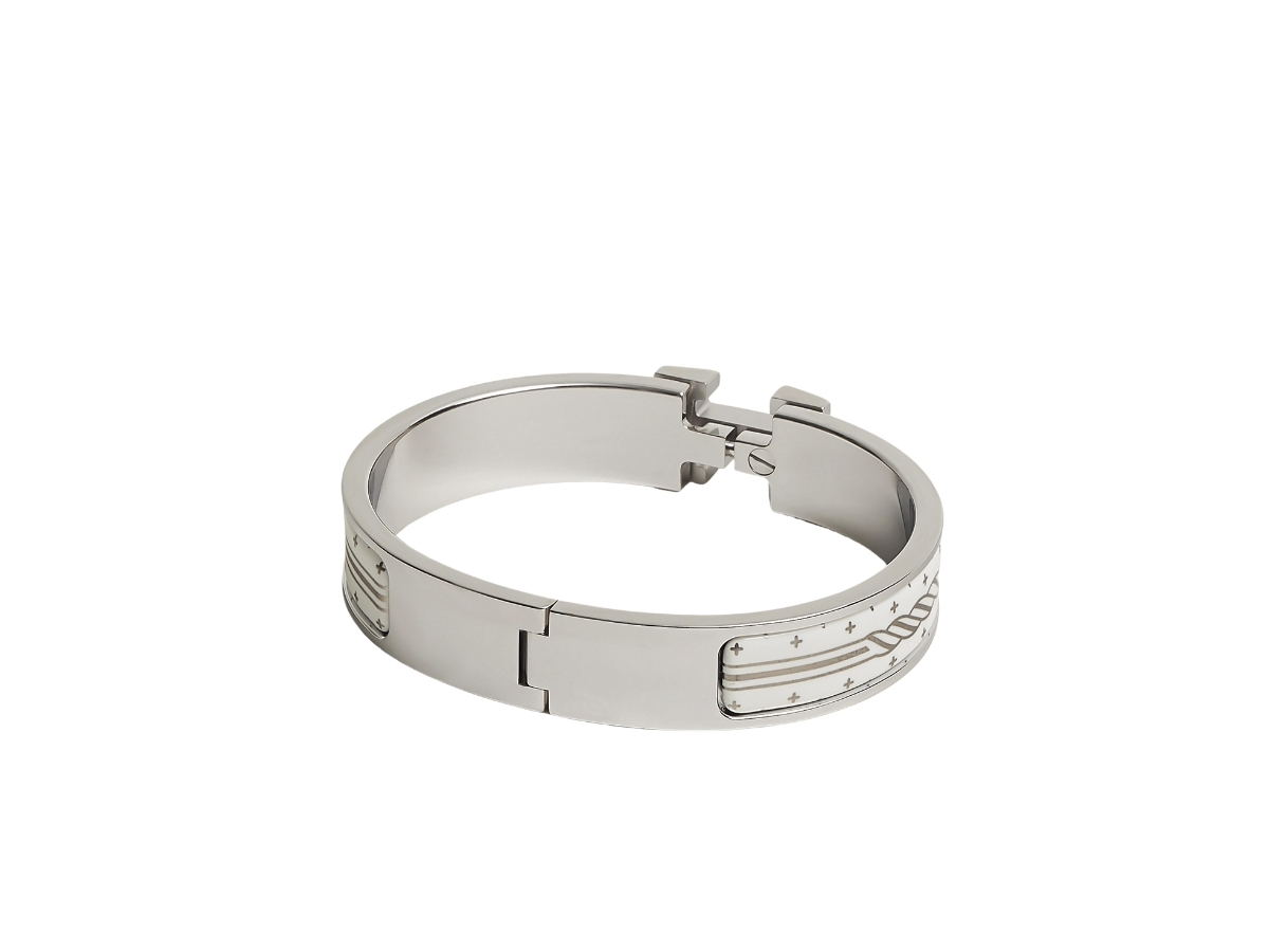 https://d2cva83hdk3bwc.cloudfront.net/hermes-clic-h-bracelet-in-quadrige-au-fil-printed-enamel-with-palladium-plated-hardware-blanc-platine-blanc-2.jpg