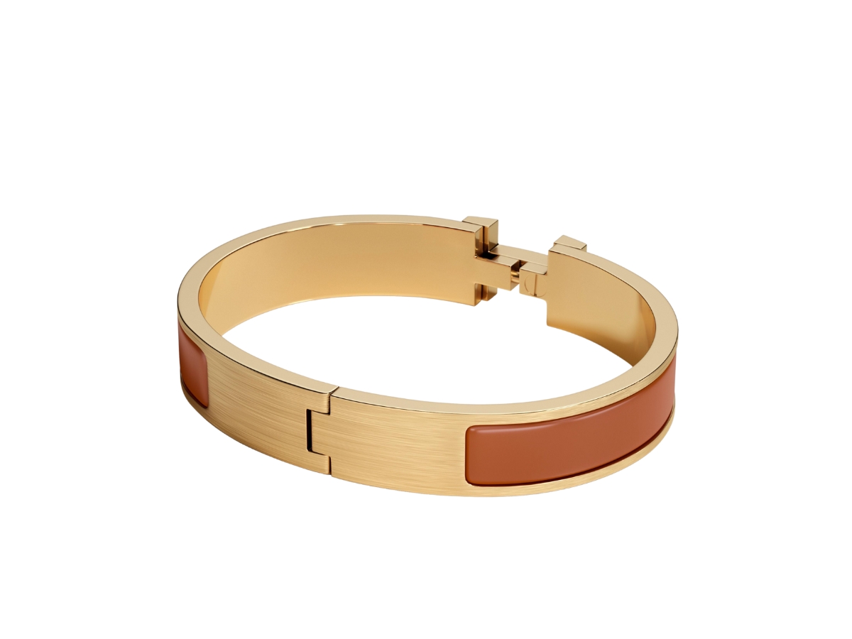 https://d2cva83hdk3bwc.cloudfront.net/hermes-clic-hh-bracelet-in-matte-enamel-with-brushed-gold-plated-hardware-gold-mat-2.jpg