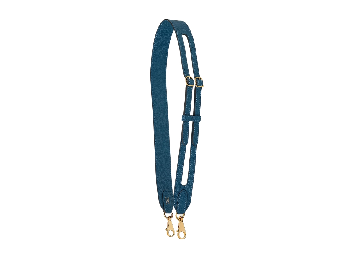 https://d2cva83hdk3bwc.cloudfront.net/hermes-harnachement-35-mm-bag-strap-in-epsom-calfskin-with-gold-plated-hardware-deep-blue-1.jpg