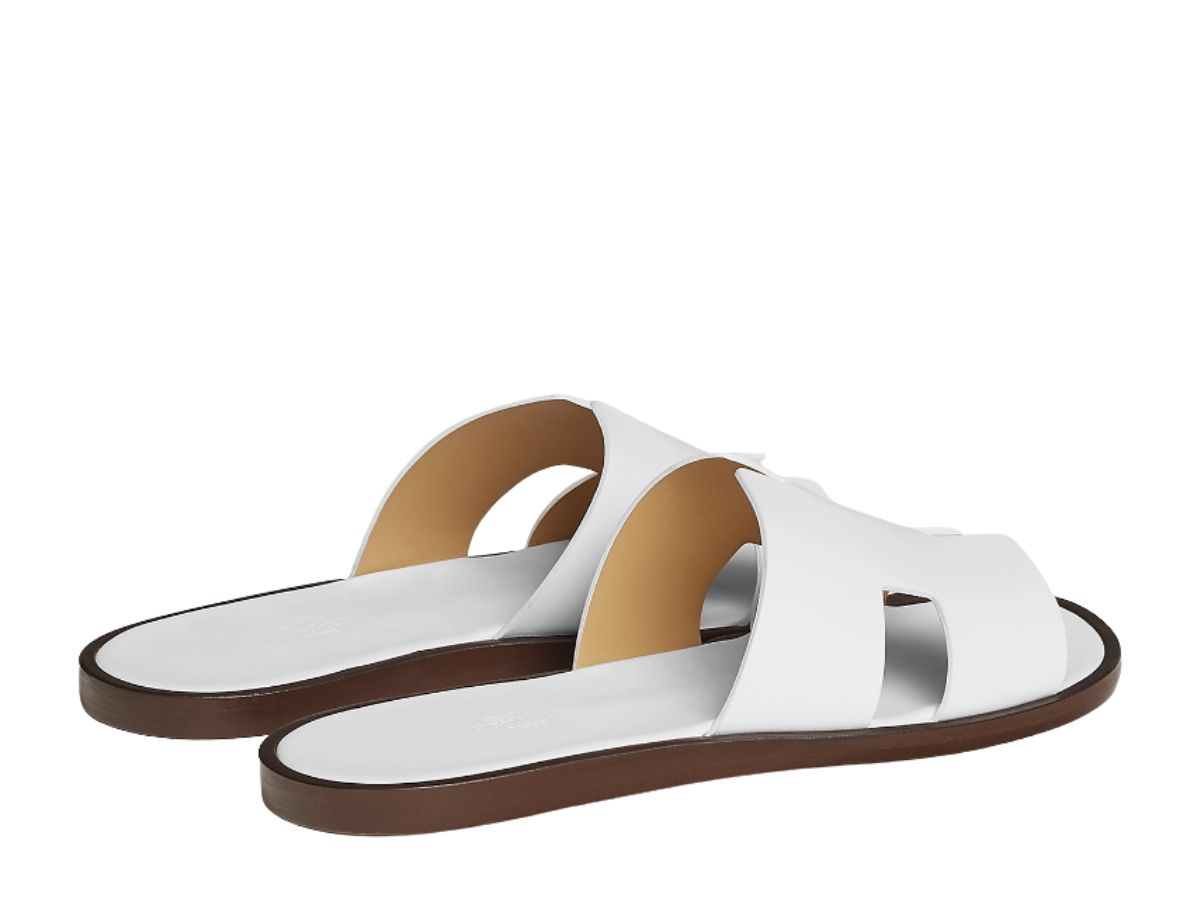 https://d2cva83hdk3bwc.cloudfront.net/hermes-izmir-sandal-in-calfskin-with-iconic-h-cut-out-and-raw-edged-detail-blanc-3.jpg