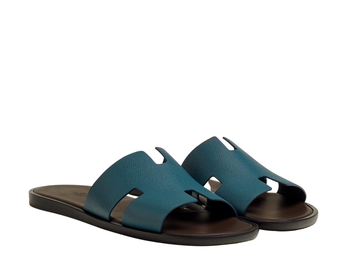 https://d2cva83hdk3bwc.cloudfront.net/hermes-izmir-sandal-in-epsom-calfskin-with-iconic-h-cut-out-bleu-canard-marron-ebene-2.jpg