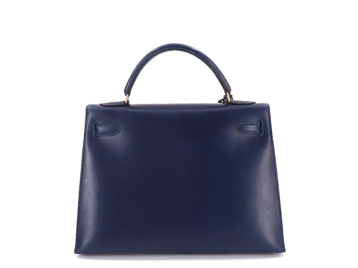 https://d2cva83hdk3bwc.cloudfront.net/hermes-kelly-32-bag-in-box-calf-leather-with-gold-tone-hardware-navy-2.jpg