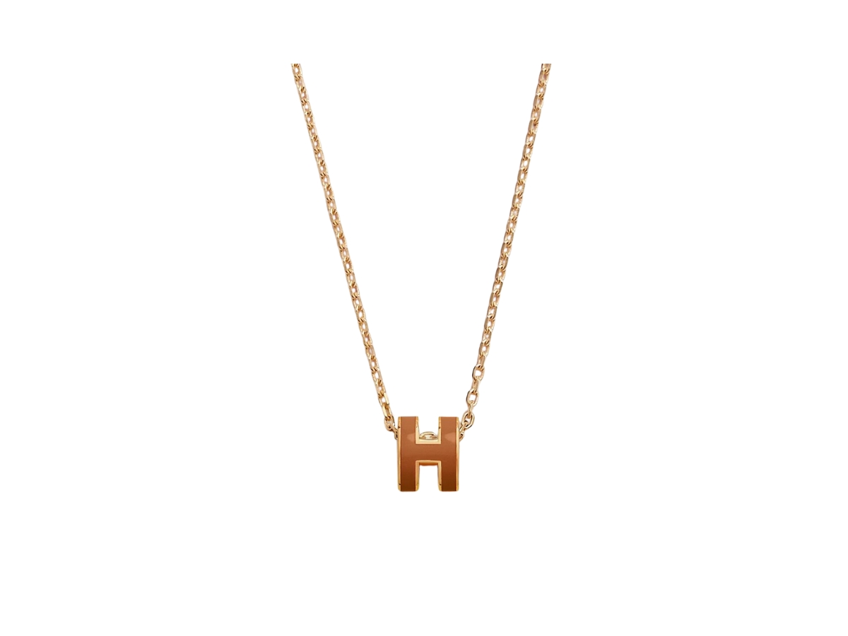 https://d2cva83hdk3bwc.cloudfront.net/hermes-mini-pop-h-pendant-in-lacquered-metal-with-gold-plated-hardware-new-gold-1.jpg