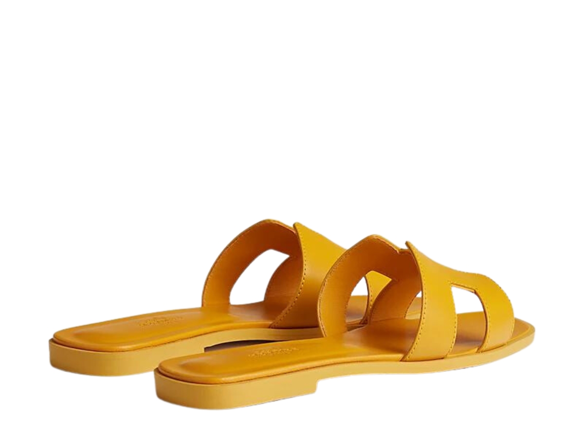 https://d2cva83hdk3bwc.cloudfront.net/hermes-oran-sandal-in-calfskin-with-iconic-h-cut-out-jaune-topaze-3.jpg