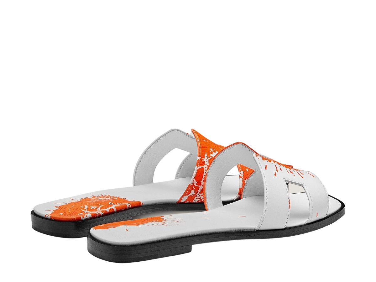 https://d2cva83hdk3bwc.cloudfront.net/hermes-oran-sandal-in-calfskin-with-peinture-fraiche-print-and-iconic-h-cut-out-blanc-orange-3.jpg