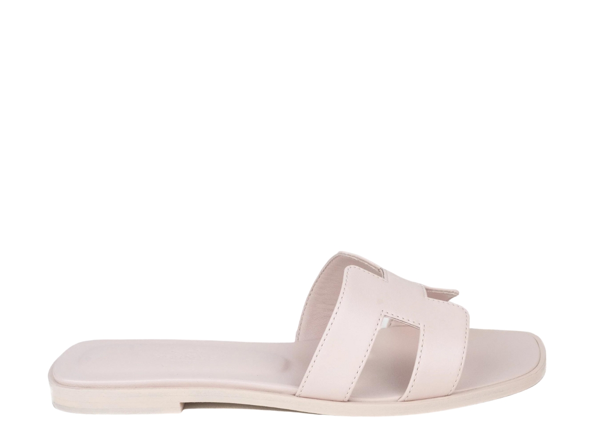 https://d2cva83hdk3bwc.cloudfront.net/hermes-oran-sandal-in-epsom-calfskin-with-iconic-h-cut-out-rose-petale-1.jpg