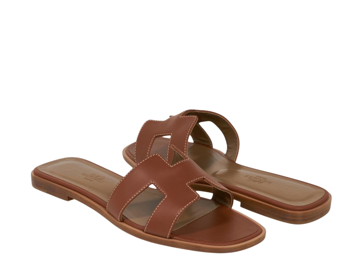 https://d2cva83hdk3bwc.cloudfront.net/hermes-oran-sandal-in-gold-box-calfskin-leather-with-iconic-h-cut-out-brown-2.jpg