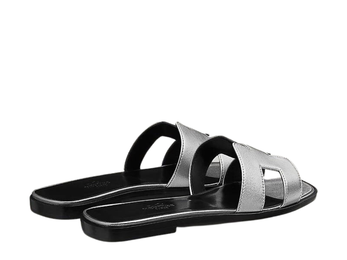 https://d2cva83hdk3bwc.cloudfront.net/hermes-oran-sandal-in-nappa-leather-with-metallic-finish-and-iconic-h-cut-out-gris-argente-vieilli-3.jpg