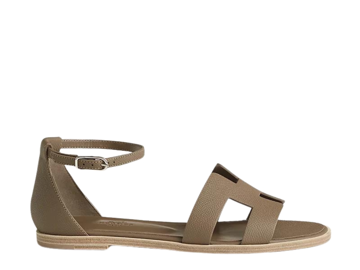 https://d2cva83hdk3bwc.cloudfront.net/hermes-santorini-sandal-in-epsom-calfskin-with-h-cut-out-detail-and-thin-ankle-strap--toupe--w--1.jpg