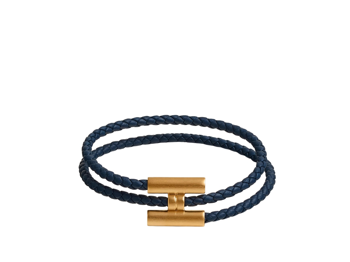 https://d2cva83hdk3bwc.cloudfront.net/hermes-tournis-tresse-bracelet-in-swift-calfskin-with-brushed-gold-plated-hardware-bleu-navy-1.jpg