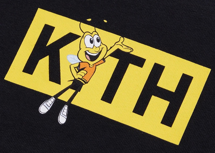 https://d2cva83hdk3bwc.cloudfront.net/kith-treats-honey-nut-cheerios-buzz-bee-classic-logo-tee-black-2.jpg