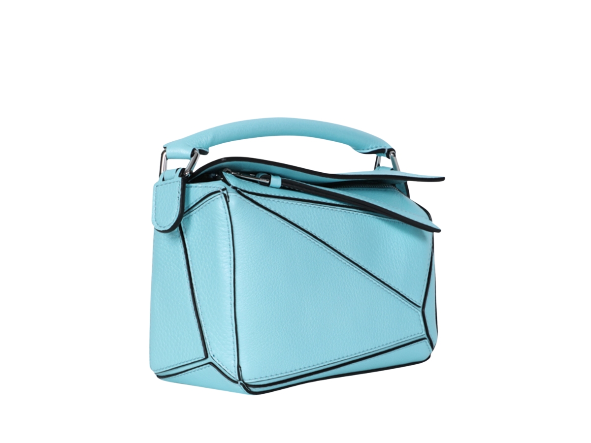 https://d2cva83hdk3bwc.cloudfront.net/loewe-mini-puzzle-bag-in-classic-calfskin-leather-with-silver-hardware-light-blue-3.jpg