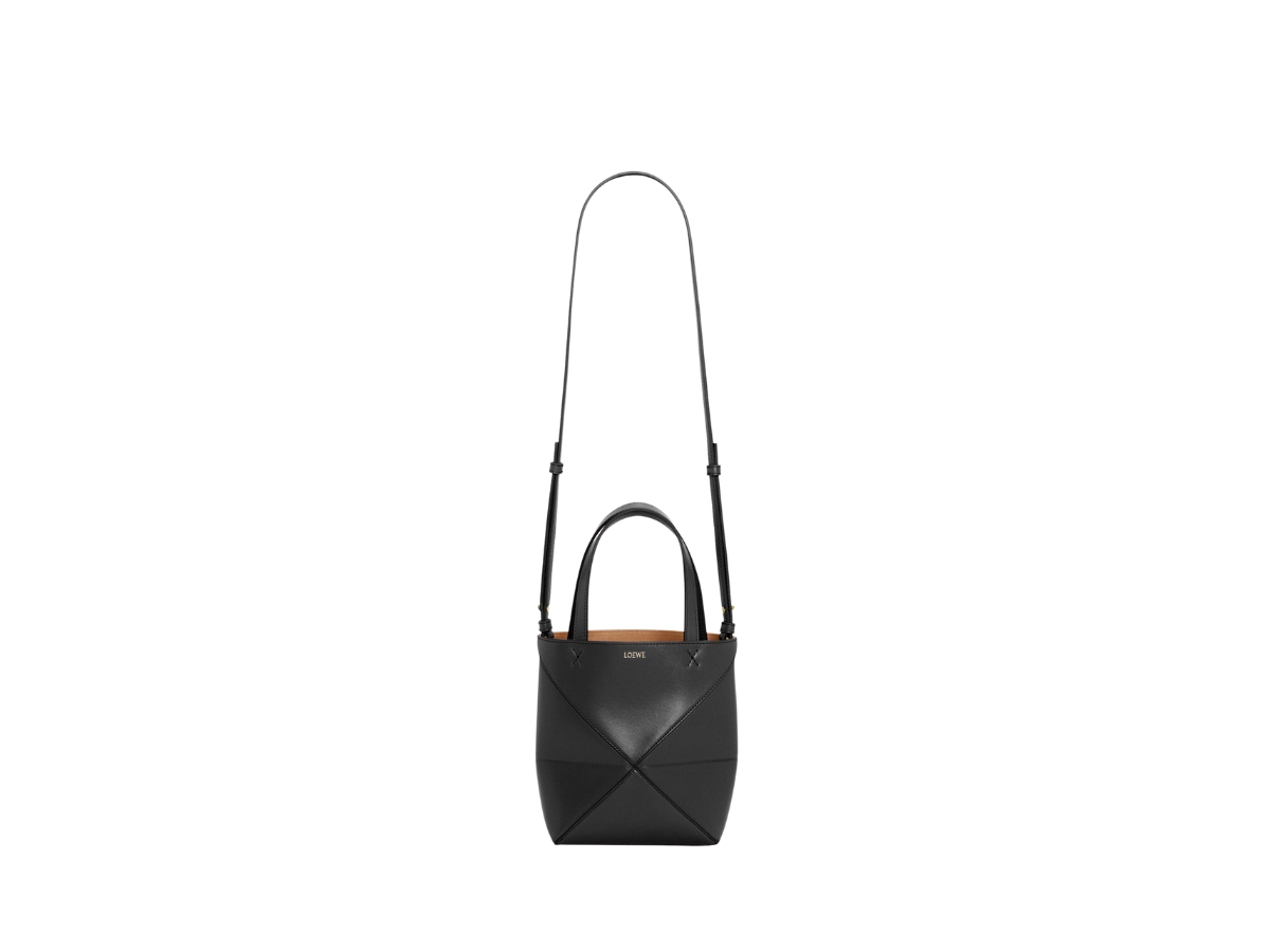 https://d2cva83hdk3bwc.cloudfront.net/loewe-mini-puzzle-fold-tote-in-shiny-calfskin-with-gold-embossed-black-3.jpg