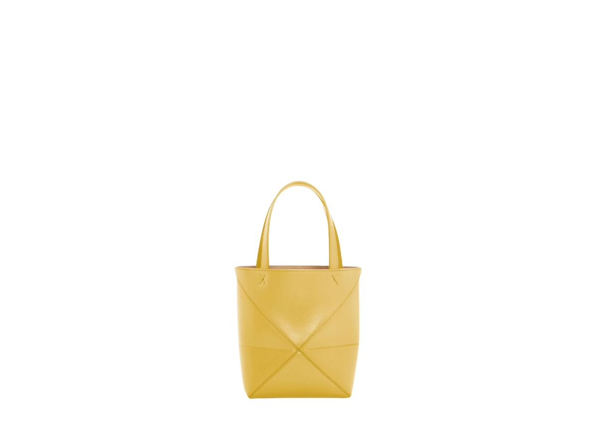 https://d2cva83hdk3bwc.cloudfront.net/loewe-mini-puzzle-fold-tote-in-shiny-calfskin-with-gold-embossed-bright-ochre-2.jpg