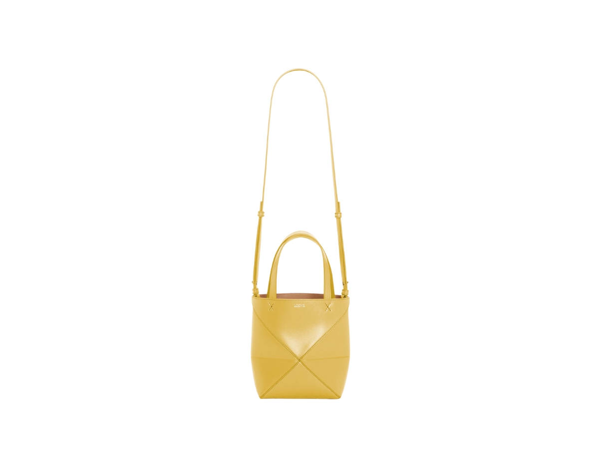https://d2cva83hdk3bwc.cloudfront.net/loewe-mini-puzzle-fold-tote-in-shiny-calfskin-with-gold-embossed-bright-ochre-3.jpg