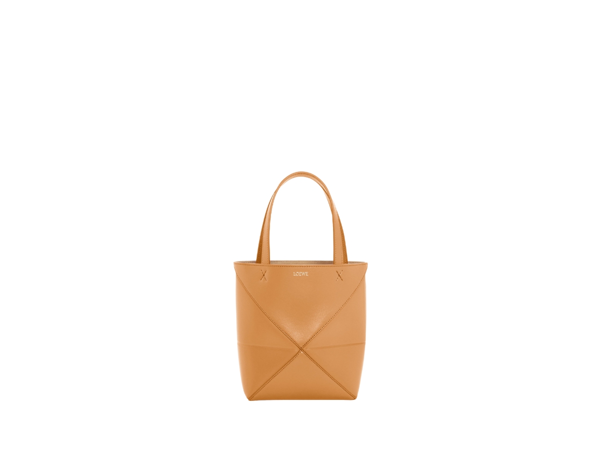 https://d2cva83hdk3bwc.cloudfront.net/loewe-mini-puzzle-fold-tote-in-shiny-calfskin-with-gold-embossed-warm-desert-1.jpg