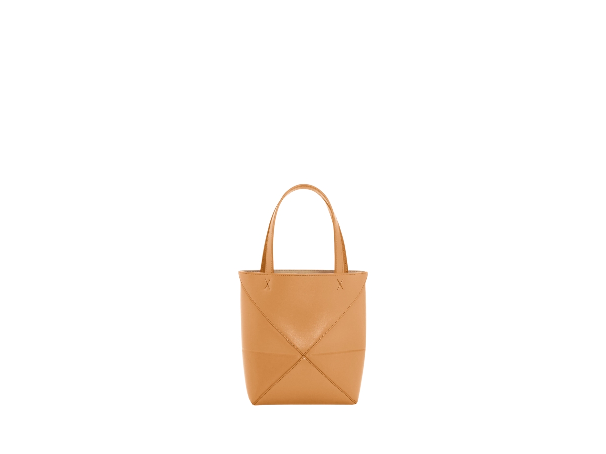 https://d2cva83hdk3bwc.cloudfront.net/loewe-mini-puzzle-fold-tote-in-shiny-calfskin-with-gold-embossed-warm-desert-2.jpg