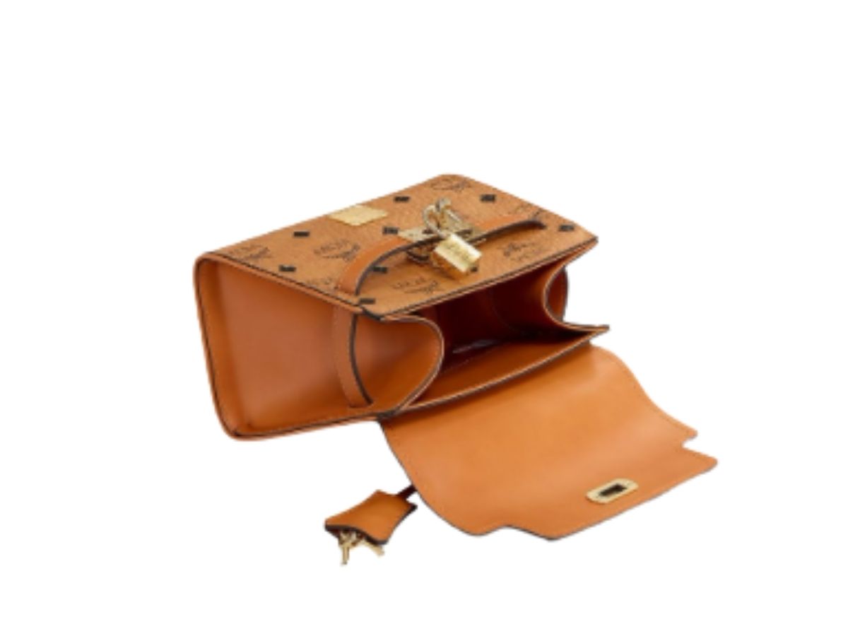 https://d2cva83hdk3bwc.cloudfront.net/mcm-heritage-satchel-in-visetos-8-3.jpg