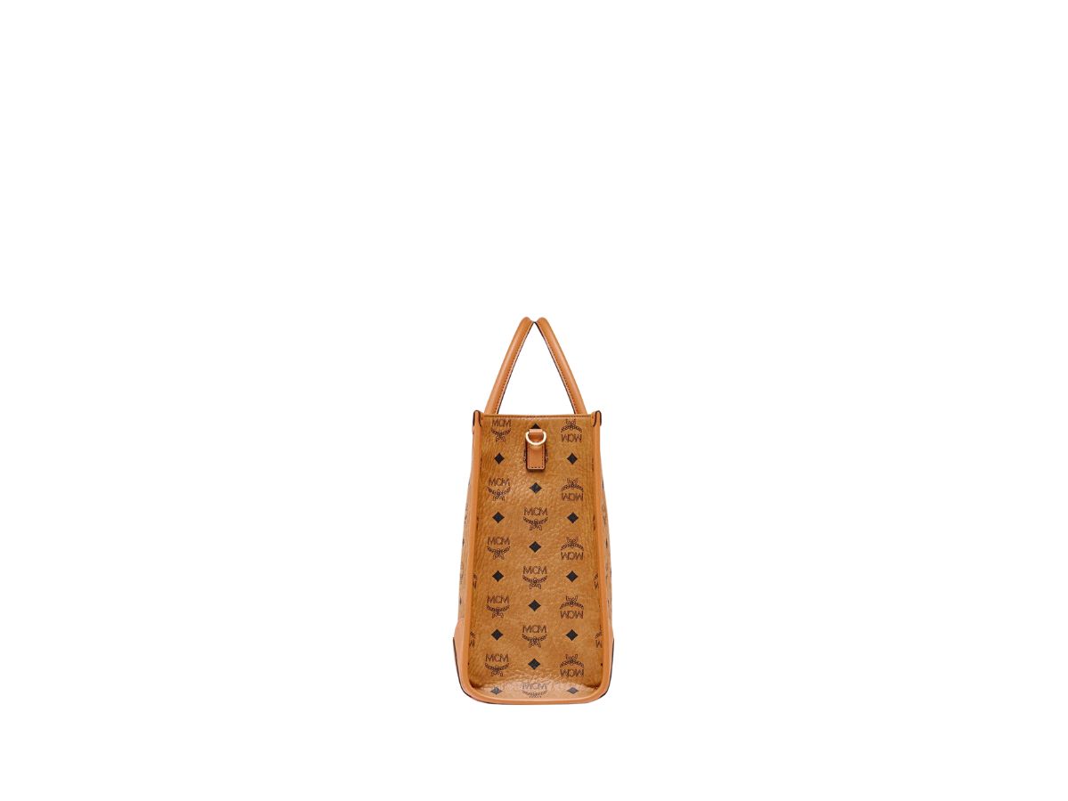 https://d2cva83hdk3bwc.cloudfront.net/mcm-m-nchen-tote-in-visetos-cognac-large-2.jpg
