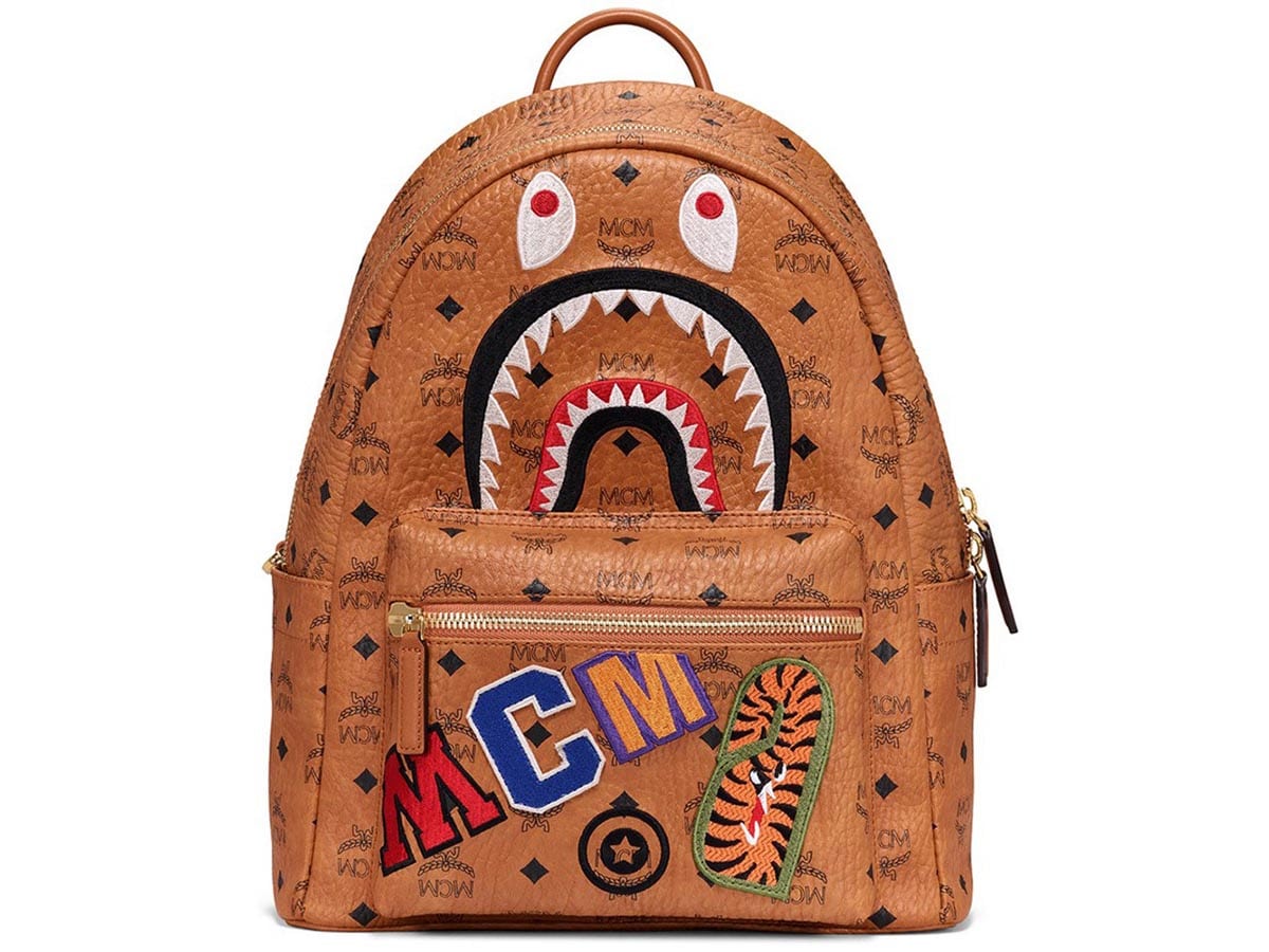 https://d2cva83hdk3bwc.cloudfront.net/mcm-x-bape-backpack-visetos-medium-cognac-1.jpg