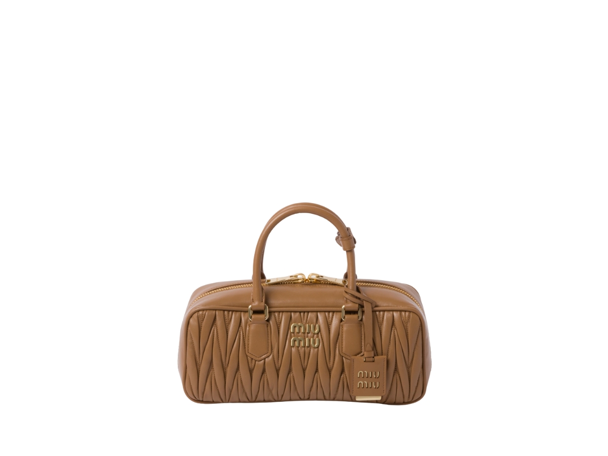 https://d2cva83hdk3bwc.cloudfront.net/miu-miu-arcadie-matelass--nappa-leather-bag-with-metal-lettering-logo-and-gold-tone-hardware-caramel--1.jpg