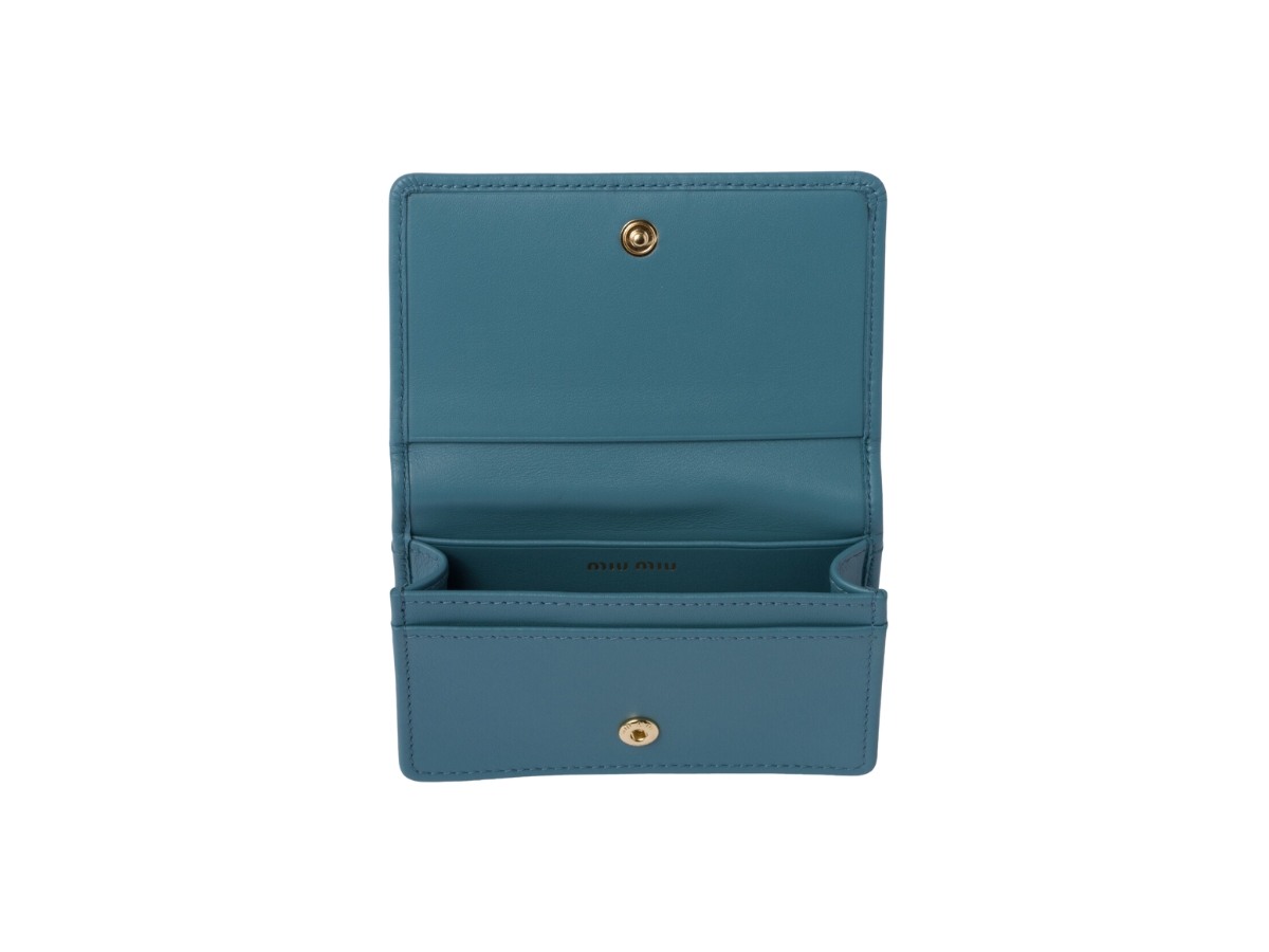 https://d2cva83hdk3bwc.cloudfront.net/miu-miu-leather-card-holder-in-three-card-slots-marina-blue-2.jpg