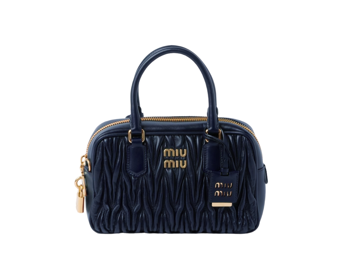 https://d2cva83hdk3bwc.cloudfront.net/miu-miu-matelass--nappa-leather-top-handle-bag-in-matelass--motif-with-gold-tone-hardware-baltic-blue-1.jpg