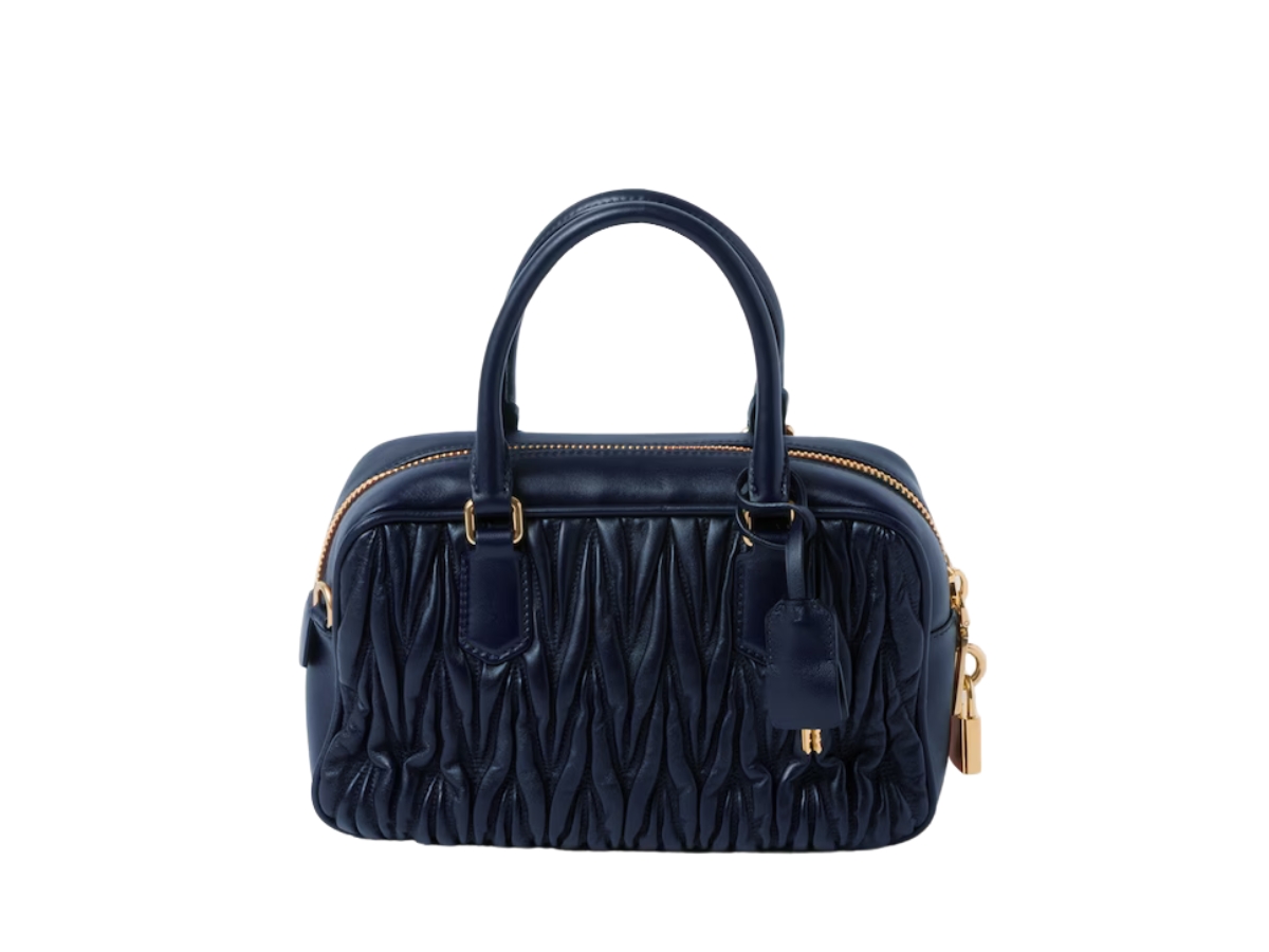 https://d2cva83hdk3bwc.cloudfront.net/miu-miu-matelass--nappa-leather-top-handle-bag-in-matelass--motif-with-gold-tone-hardware-baltic-blue-2.jpg