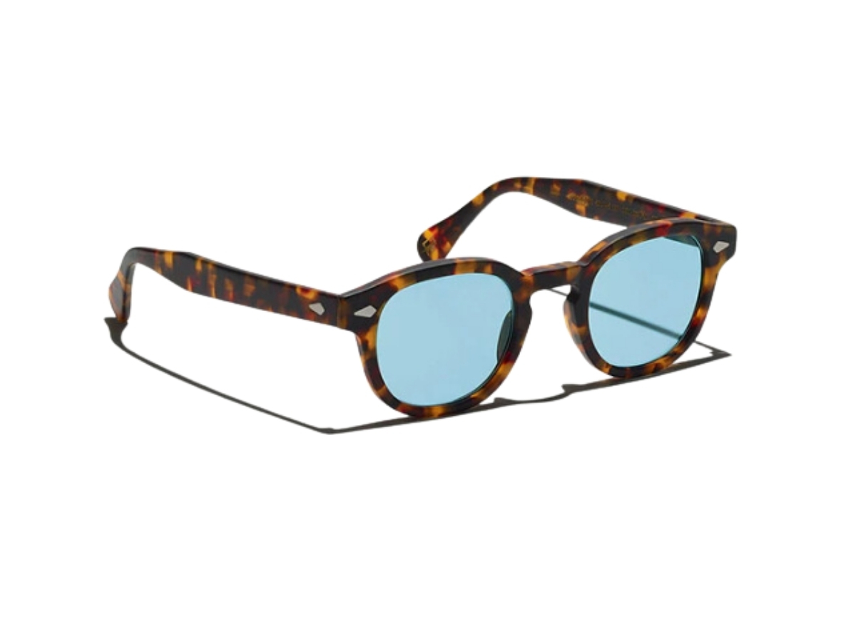https://d2cva83hdk3bwc.cloudfront.net/moscot-lemtosh-sun-46-mm-in-matte-tortoise-acetate-frame-diamond-rivets-with-mineral-blue-lenses-2.jpg